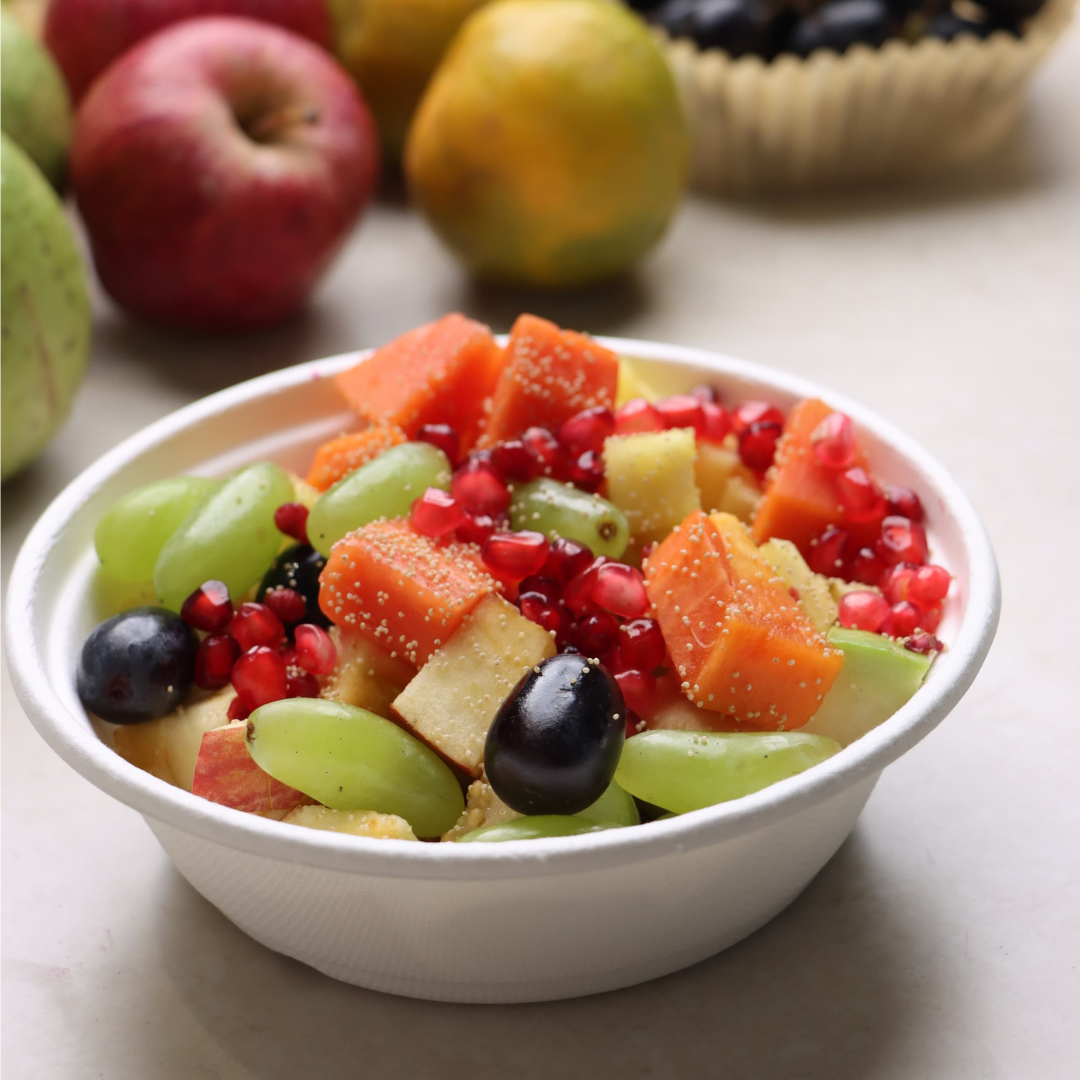 Fresh fruit salad bowl and Freshly Fruits mango smoothie bottle in Indore